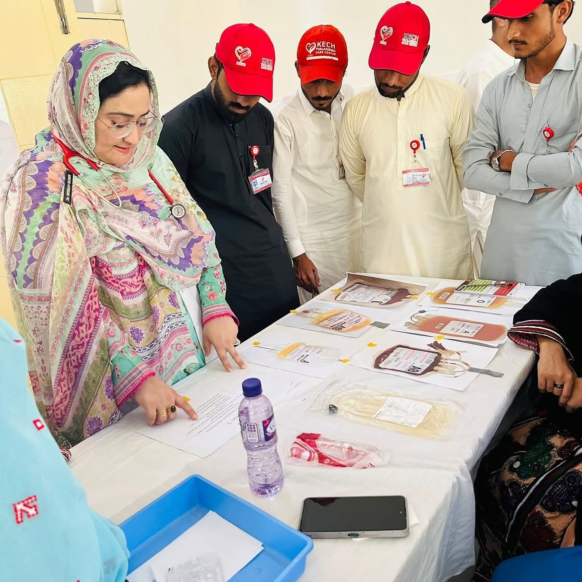 Dr. Misbah Munir explaining blood bag labels to the KTCC team at the transfusion workshop