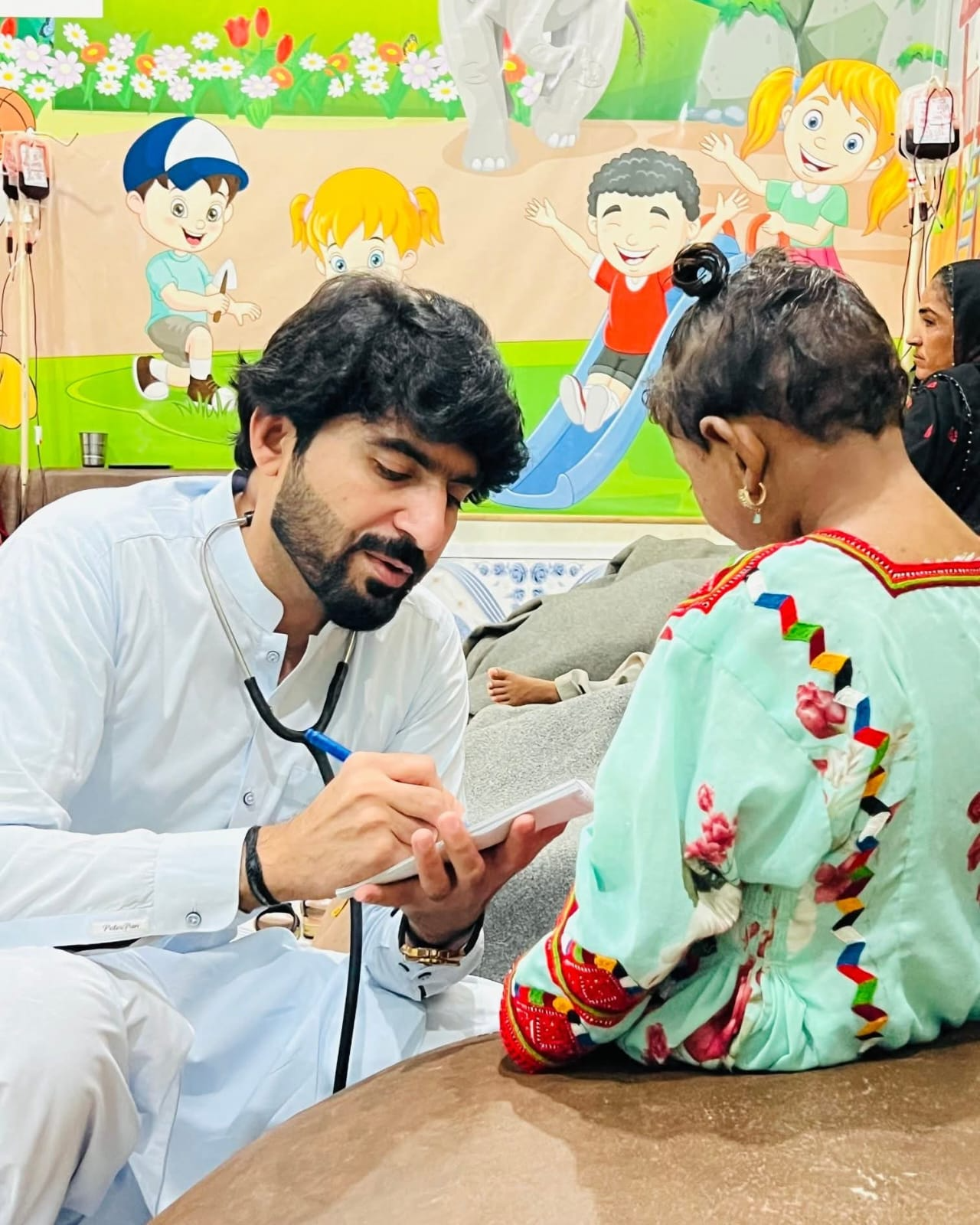 KTCC doctor examining a young thalassemia patient